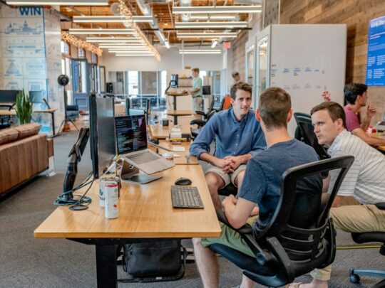 Professionals discussing a project in an office